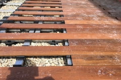 how-to-build-ipe-decking-on-inverted-waterproofing-7-click-boards-into-clips-on-rails
