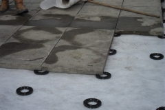 Installation of paving onto pads