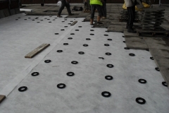 Paving slabs onto plastic paving rings