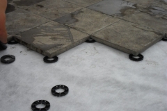 Plastic pave rings under concrete flags