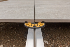 Pedestal Rail System Megapad with rail and headpiece attached and porcelain tile installed