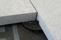 Minipad for paving with granite slabclose up