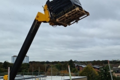 Extendable-Forklift-lifting-Wildflower-M-Tray-onto-Roof-of-Turing-House-Pic-1-2