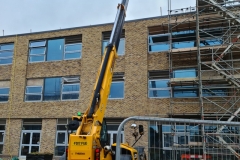 Widlflower-M-Trays-being-lifted-onto-Roof-of-Turing-House-by-Extenadble-Forklift-Pic-1