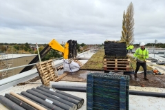 Wildflower-M-Tray-lifted-onto-Roof-with-Extendable-Forklift-being-laid-with-Geotextile-underneath-Pic-1