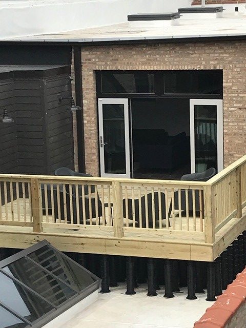 An image of a decking installation using Wallbarn's MegaPad pedestals in Chicago