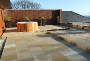 Roof terrace with 9mm rubber pave pads suspending sandstone slabs