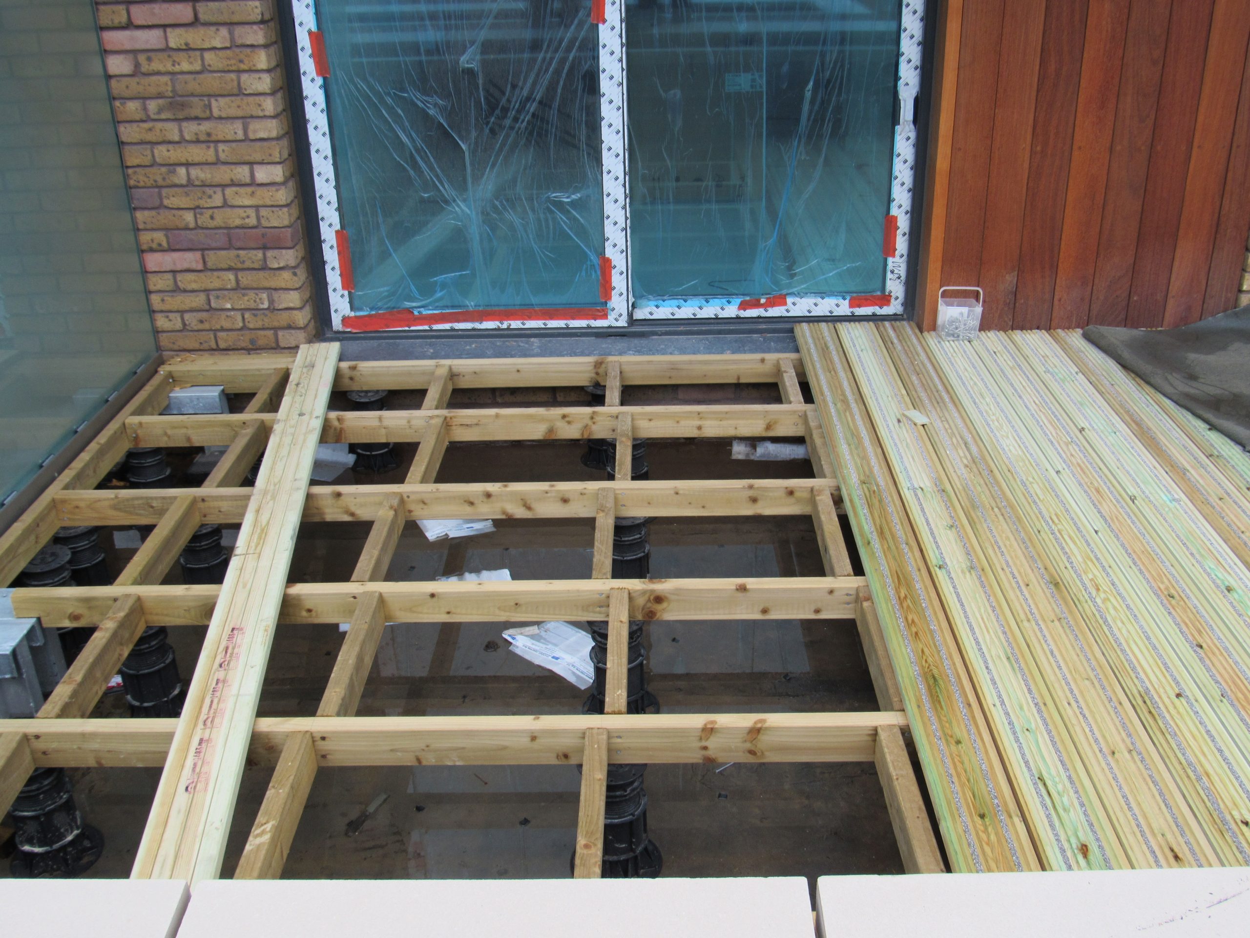 Adjustable decking pedestals for decking to door threshold 5
