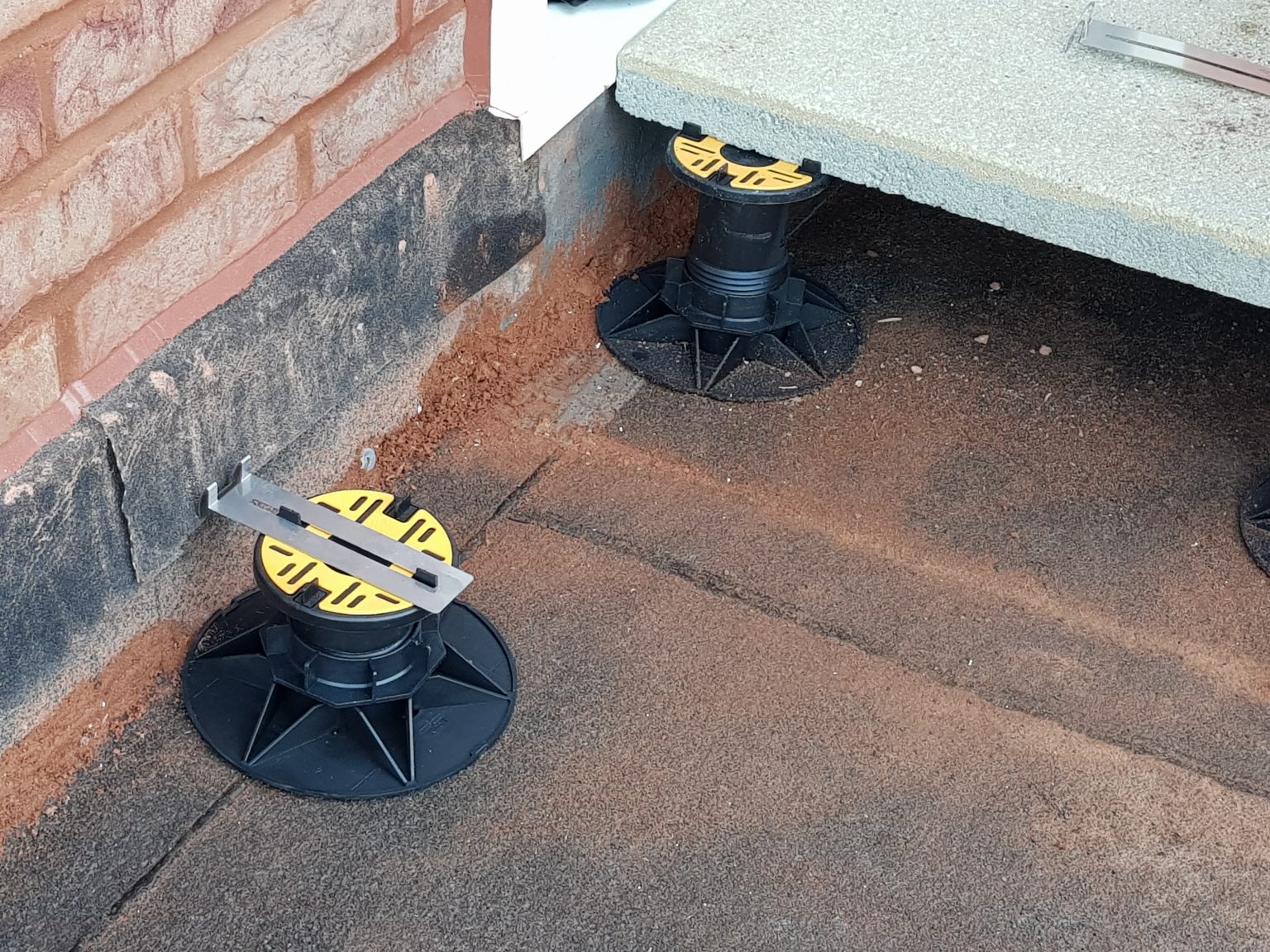 Universal Pedestal for paving and decking close up with slab 16