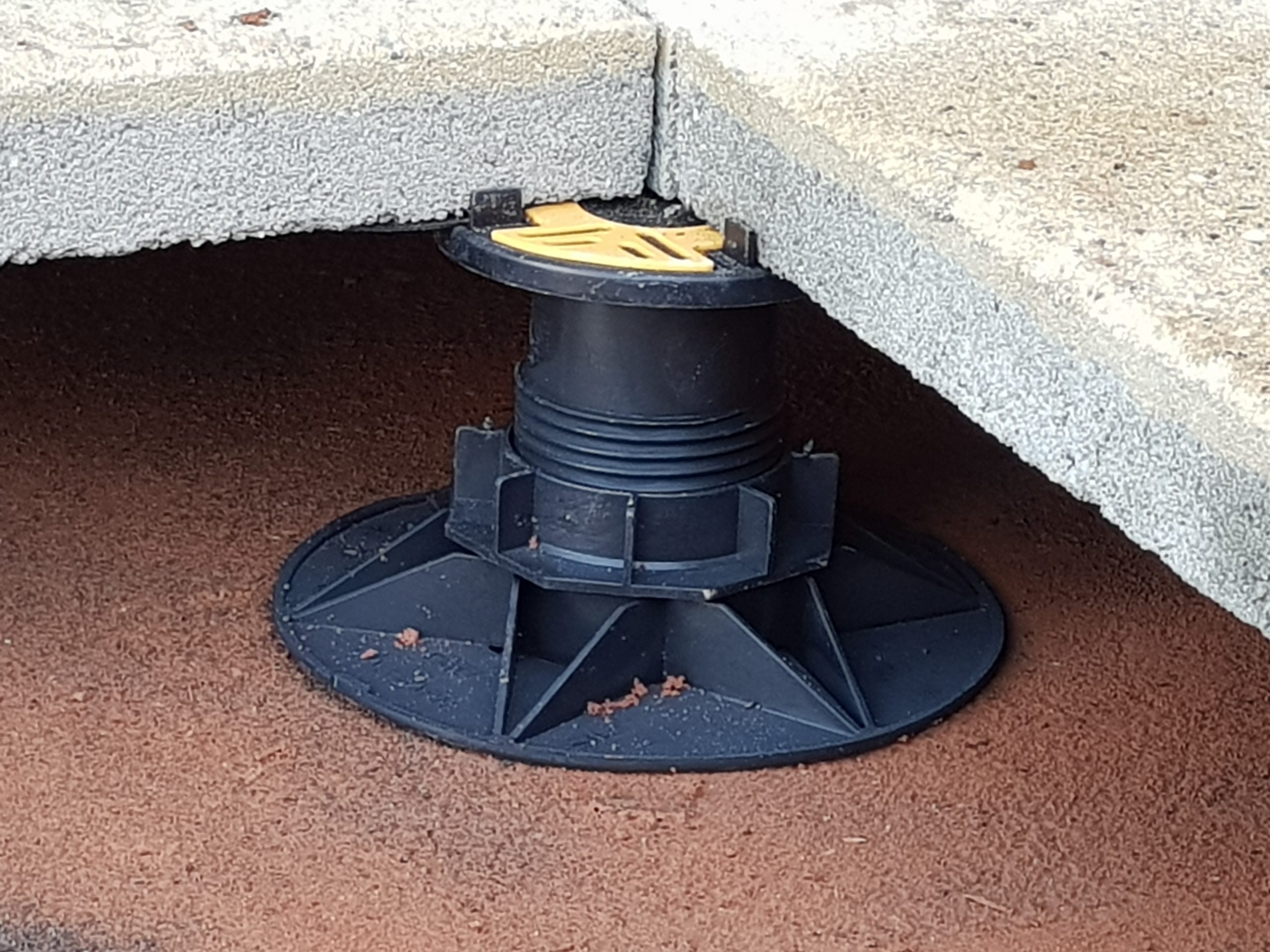 Universal Pedestal for paving and decking close up with slab 4 Wallbarn