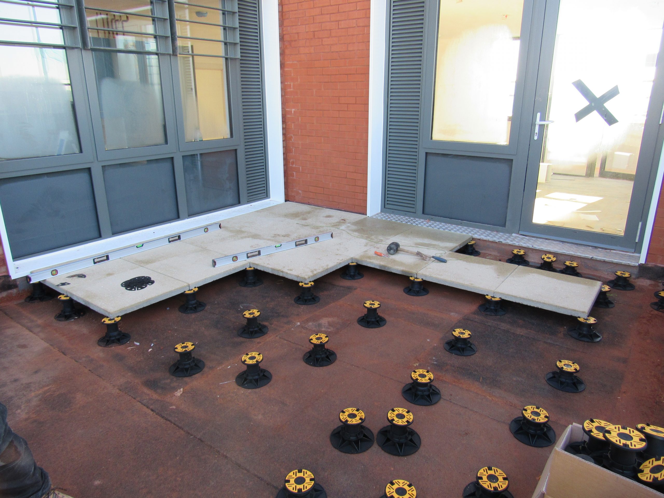 Universal Pedestal for paving and decking laid out for slabs 1 Wallbarn