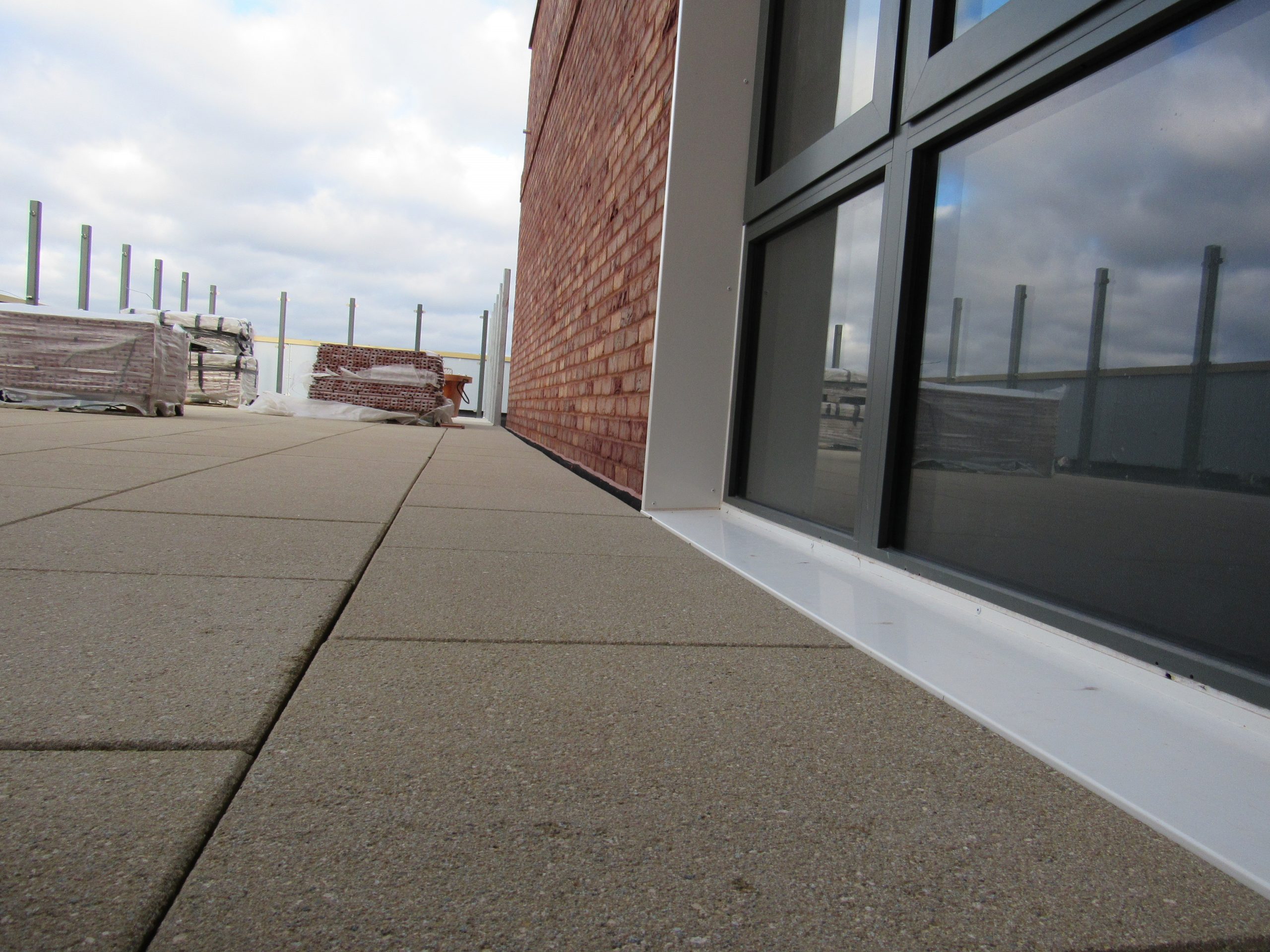 Universal pedestals for paving and decking paved terrace up to door