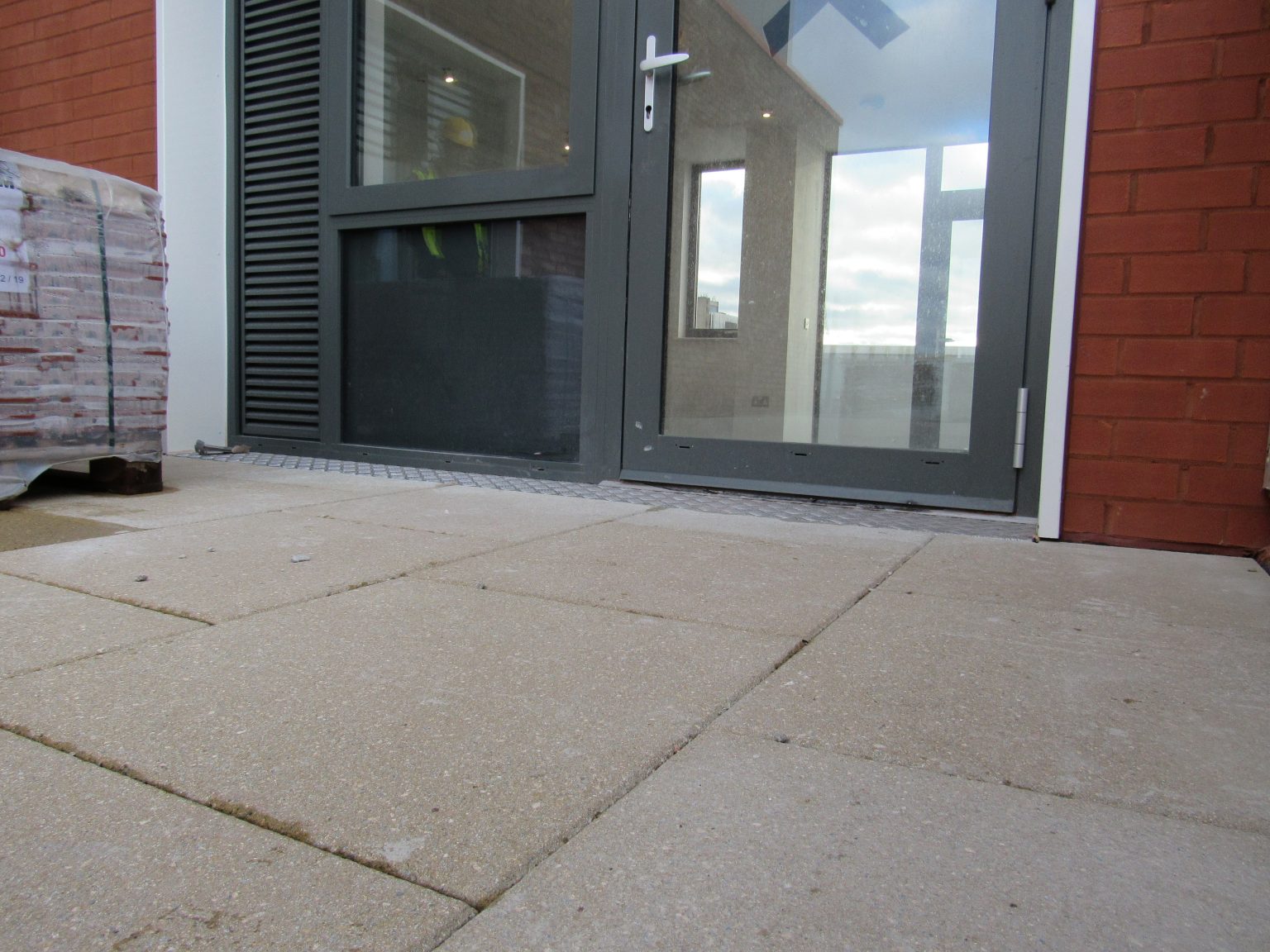 Universal pedestals for paving and decking paved terrace up to door