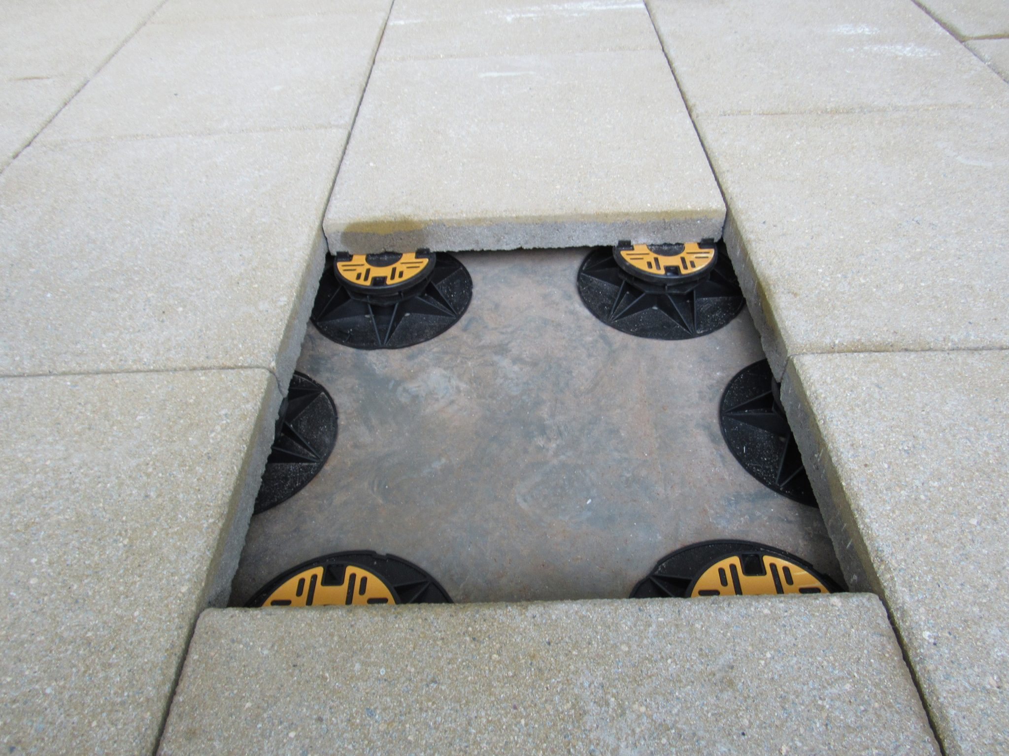 Universal pedestals for paving and decking supporting paving slabs