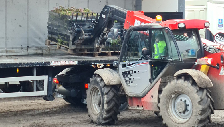 Wildflower-M-Trays-being-lifted-off-truck-by-Forklift---Pic-4